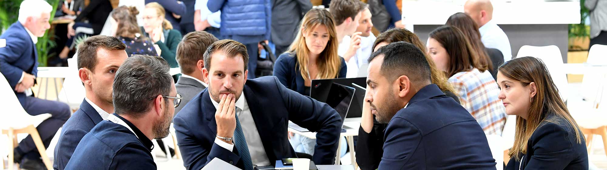 Discussions between exhibitors and visitors on a stand at the Siec